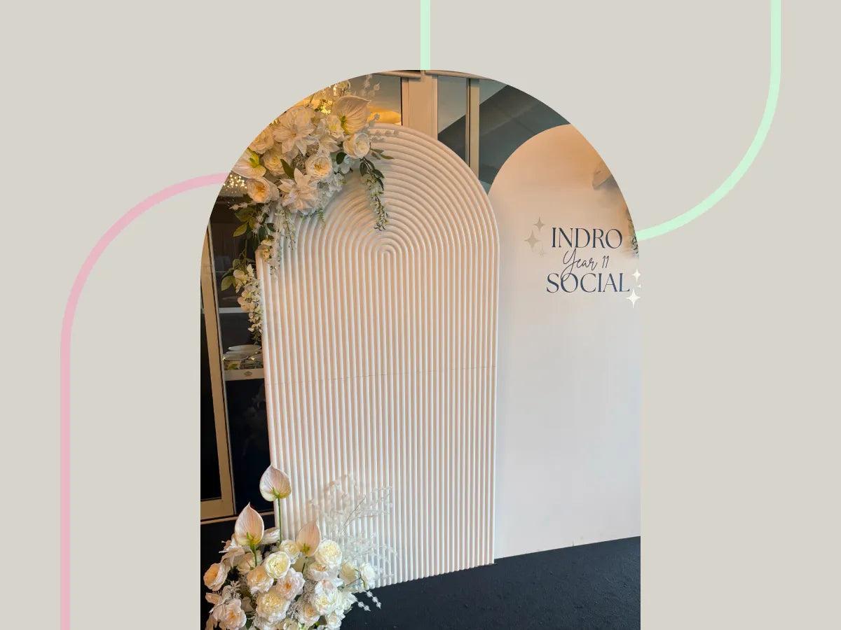 two backdrops for hire next to each other, in sand ripple and plain white